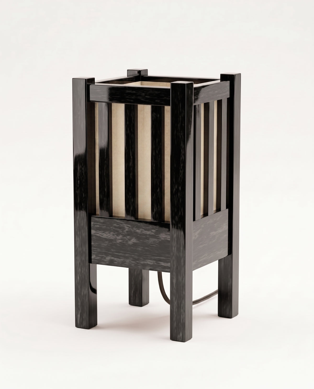Cardinal table lamp in black lacquered wood, slatted lantern cage around a warm paper shade, Monde Singulier Editions, front view