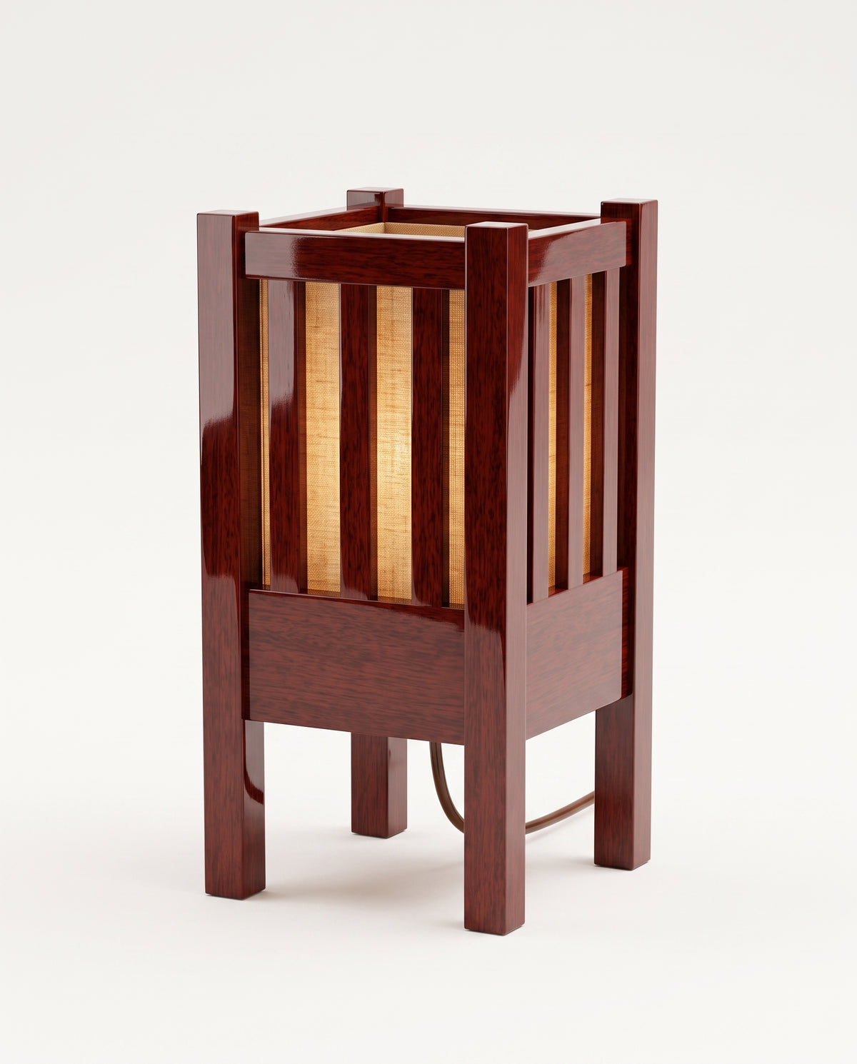 Cardinal table lamp in mahogany lacquered wood, slatted lantern cage around a warm paper shade, Monde Singulier Editions, three-quarter view