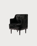 Fauteuil Romance, laque noire, vue d'ensemble sur fond blanc cassé, Monde Singulier Editions