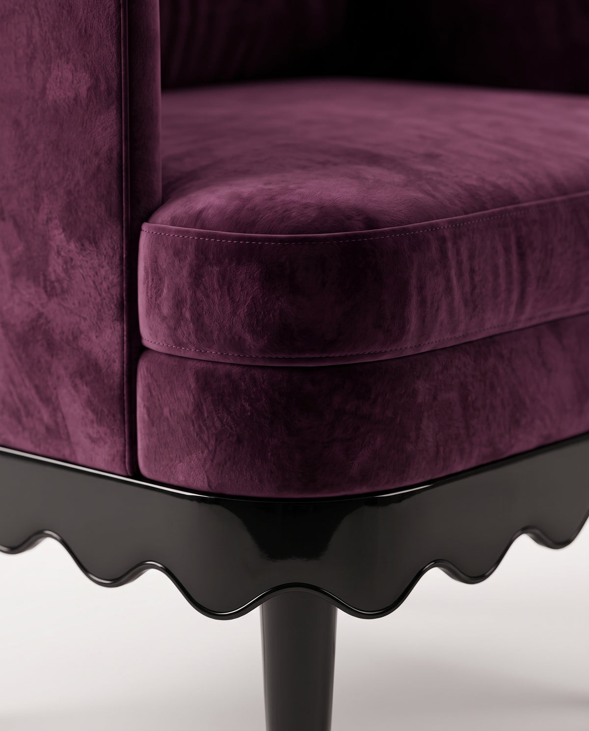 Romance armchair in aubergine velvet, close-up of the scalloped black lacquer skirt and turned leg, Monde Singulier Editions