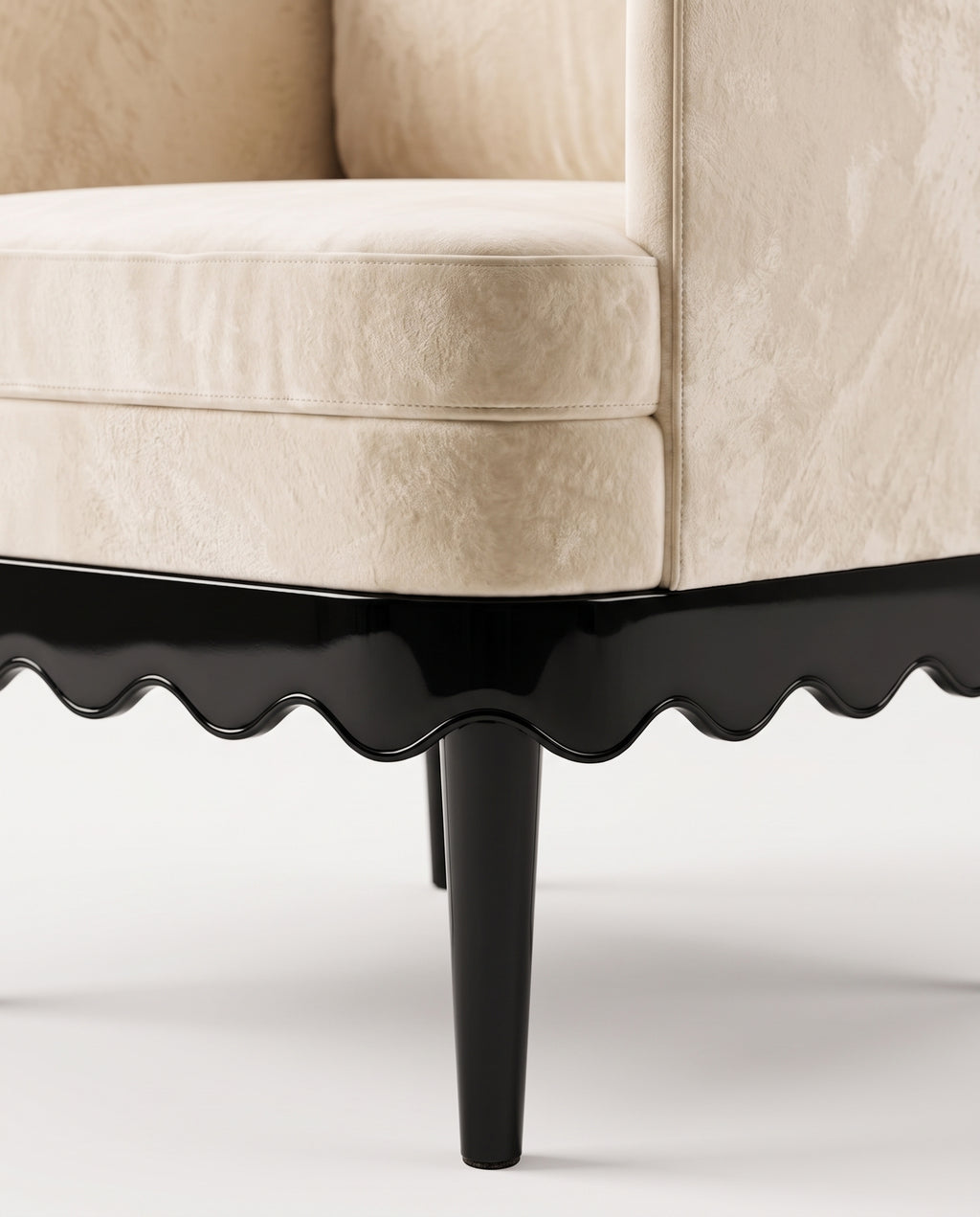Romance armchair in ecru velvet, close-up of the scalloped black lacquer skirt and turned leg, Monde Singulier Editions
