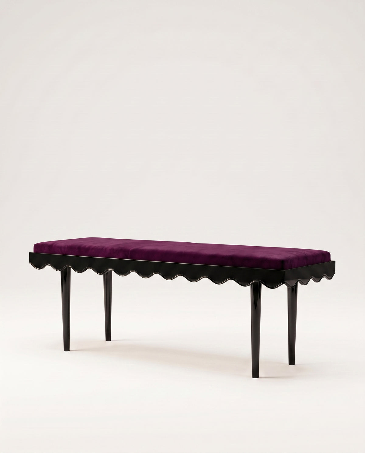 Romance upholstered bench in aubergine velvet with scalloped skirt and black lacquer legs, Monde Singulier Editions, three-quarter view