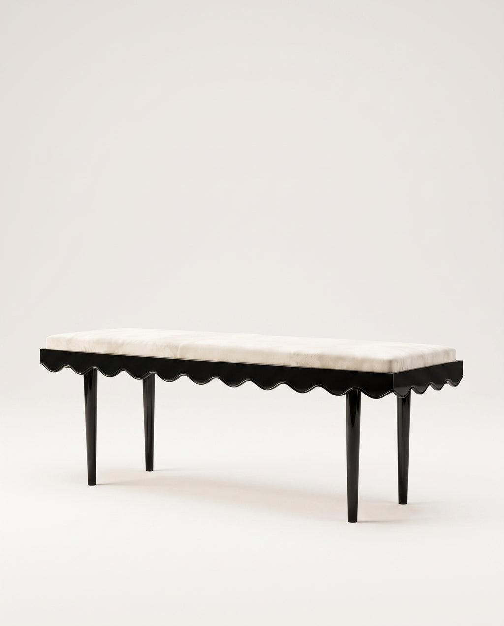 Romance upholstered bench in ecru velvet with scalloped skirt and black lacquer legs, Monde Singulier Editions, three-quarter view