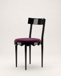 Romance dining chair with aubergine velvet seat, curved black lacquer back and scalloped skirt, Monde Singulier Editions, side view