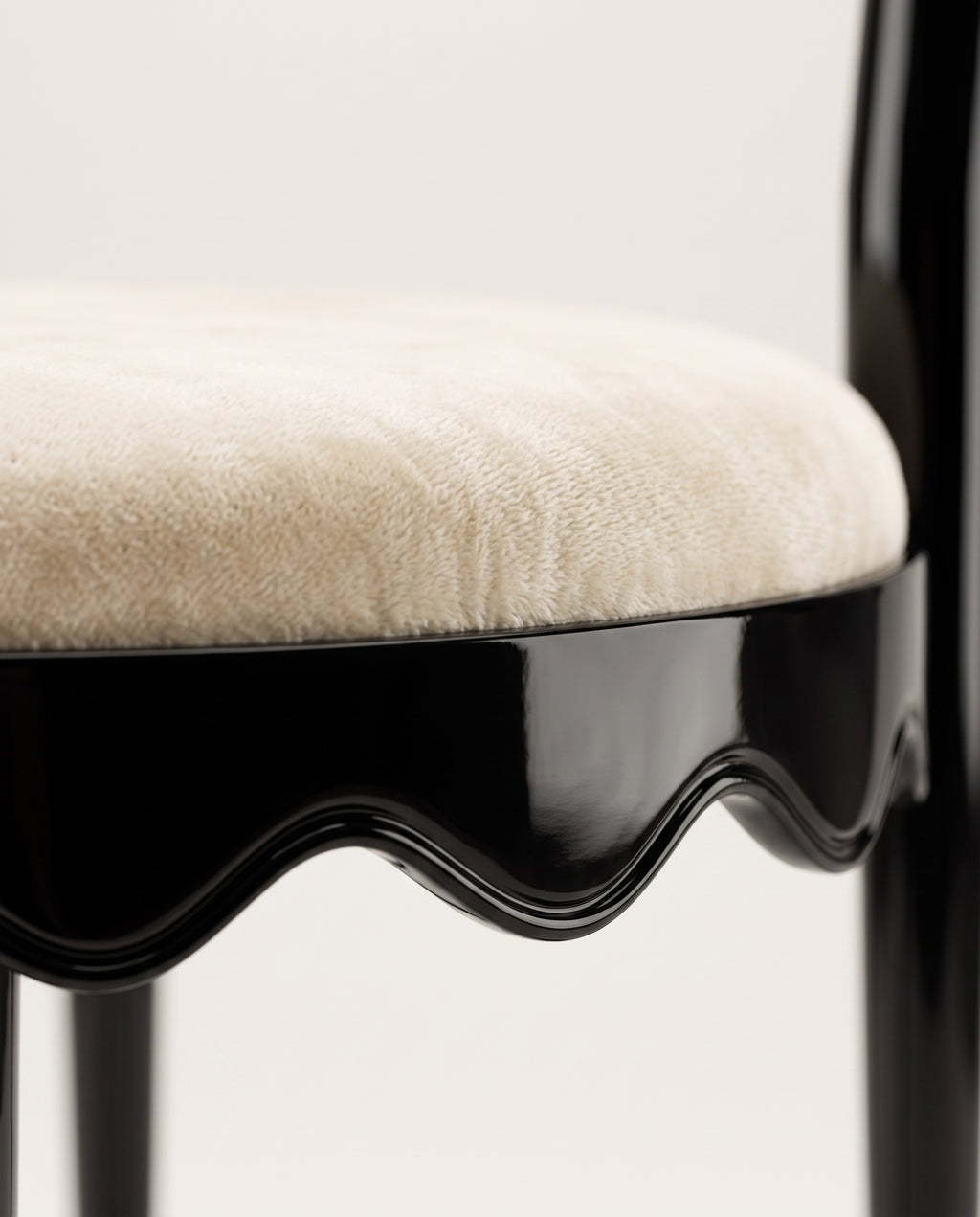 Romance chair, close-up of the round ecru velvet seat and scalloped black lacquer skirt, Monde Singulier Editions