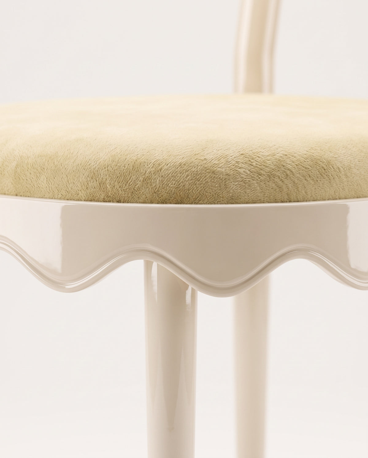 Romance chair in off-white, close-up of the round velvet seat and scalloped lacquer skirt, Monde Singulier Editions