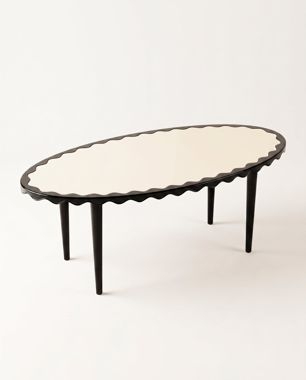Romance oval dining table in black lacquer, elevated view showing the scalloped edge running the full perimeter, Monde Singulier Editions