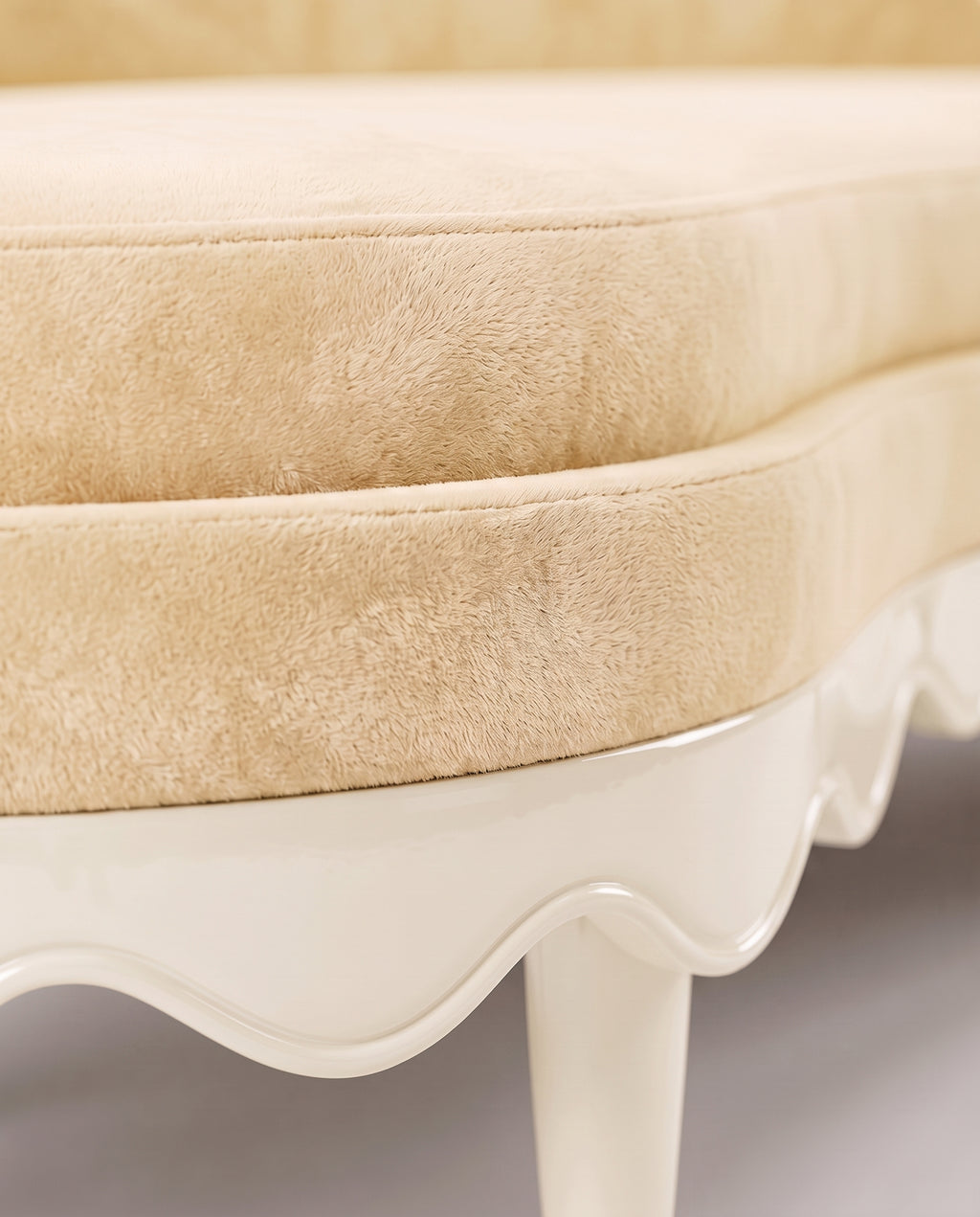 Romance sofa in off-white, close-up of the velvet seat and scalloped lacquer base, Monde Singulier Editions