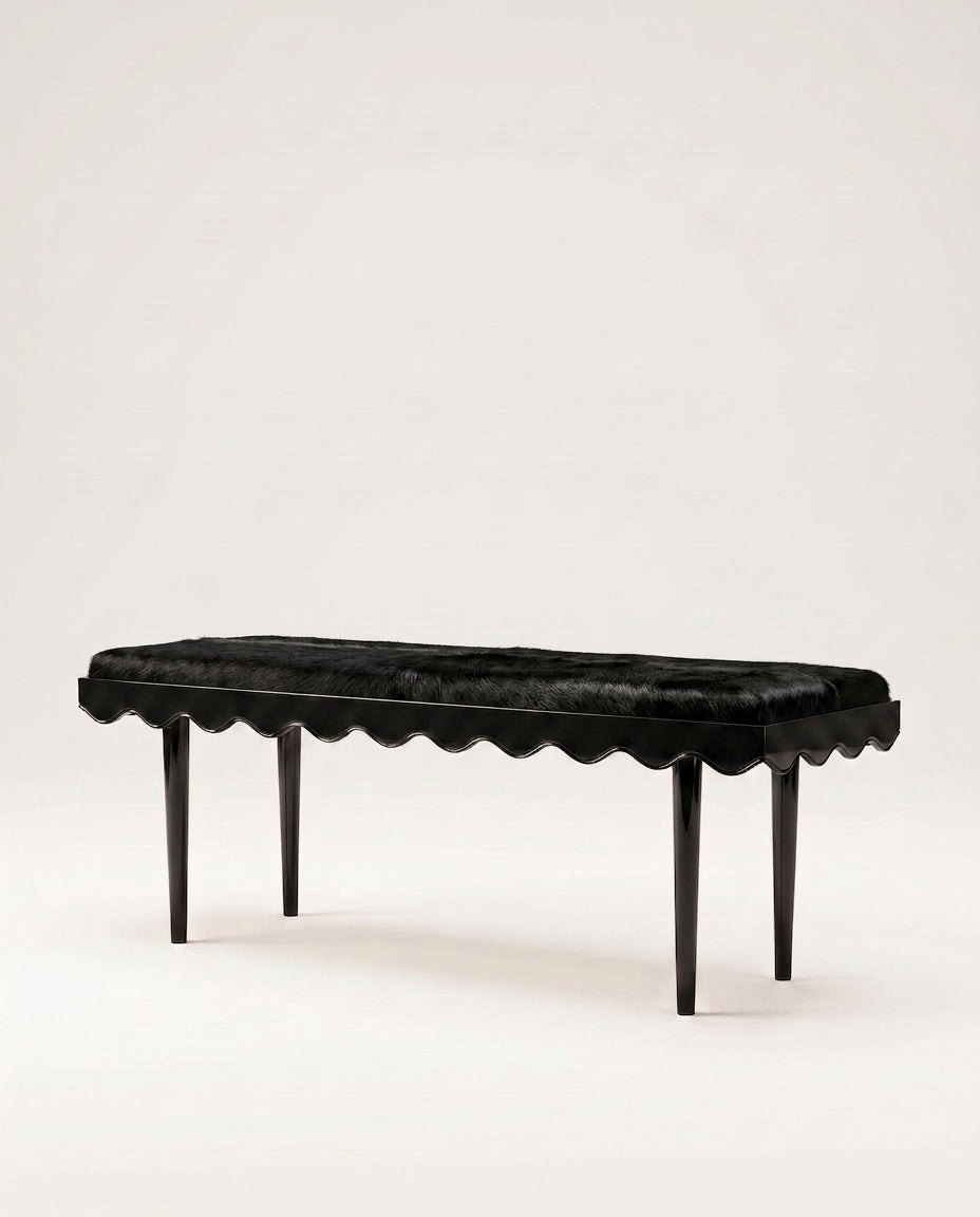 Romance upholstered bench in black with scalloped skirt and black lacquer legs, Monde Singulier Editions, three-quarter view