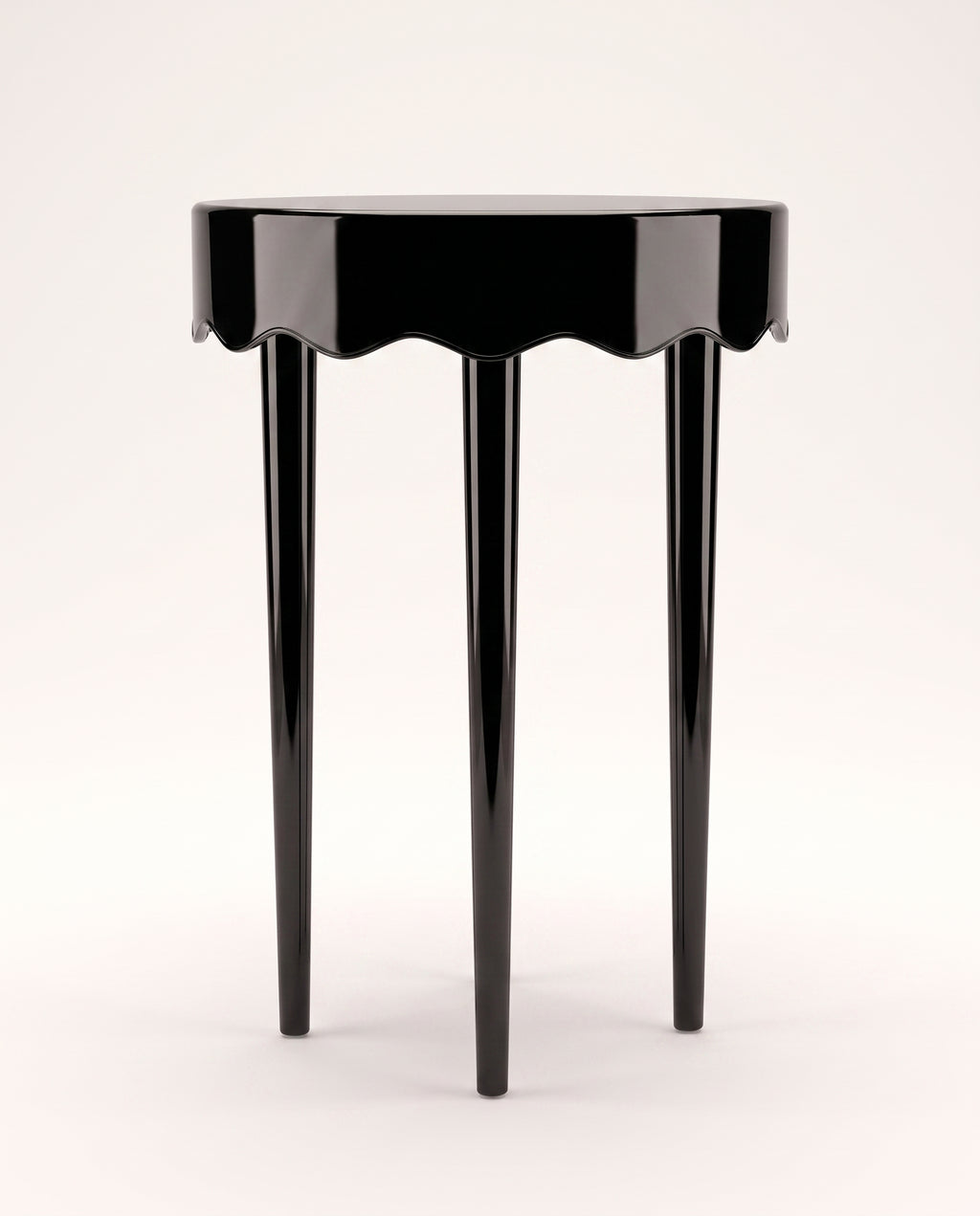 Romance round side table in black lacquer with scalloped apron and three tapered legs, Monde Singulier Editions, front view