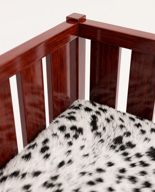 Cardinal sofa, close-up of the mahogany lacquer slats and spotted black and white cow hide cushion, Monde Singulier Editions