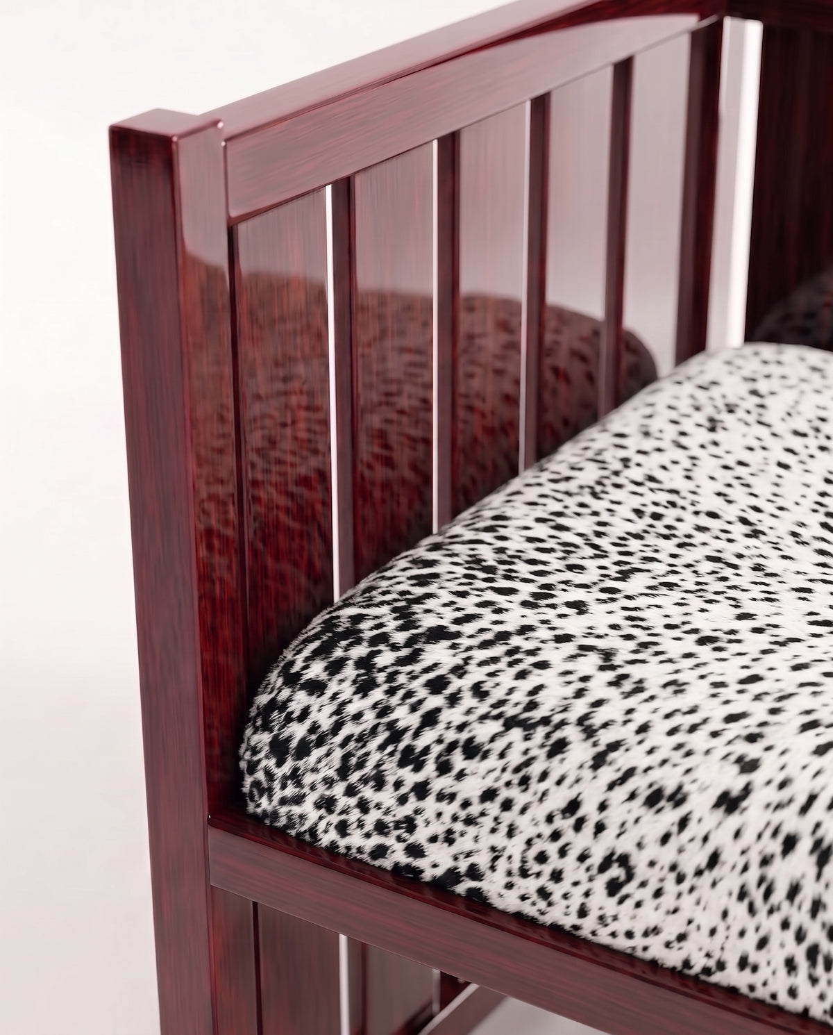 Cardinal armchair, close-up of the mahogany lacquer slats and spotted cow hide seat, Monde Singulier Editions