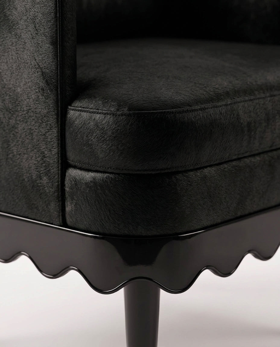 Romance armchair in black, close-up of the velvet seat, scalloped black lacquer skirt and turned leg, Monde Singulier Editions