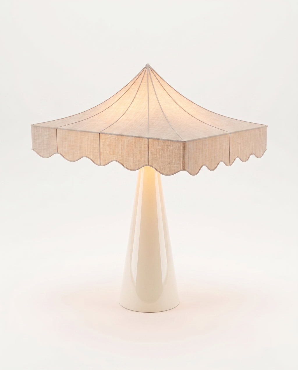 Romance table lamp in off-white lit, warm glow through the scalloped paper shade, Monde Singulier Editions