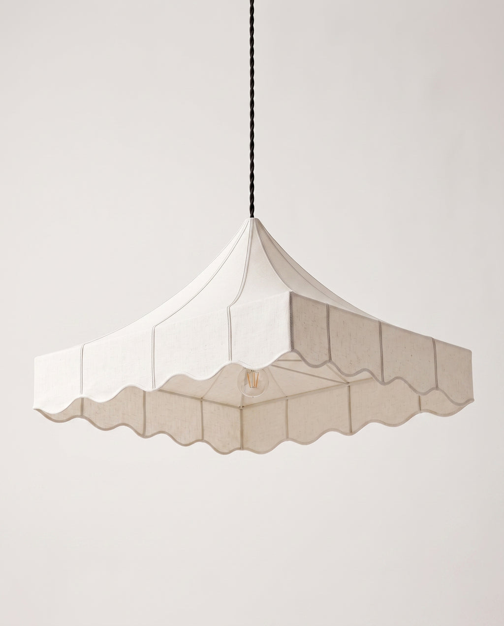 Romance pendant lamp in off-white paper, view from below showing the scalloped hem and tent structure, Monde Singulier Editions